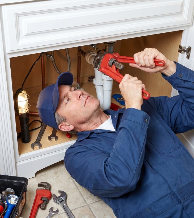 professional plumber fixing 202604261416